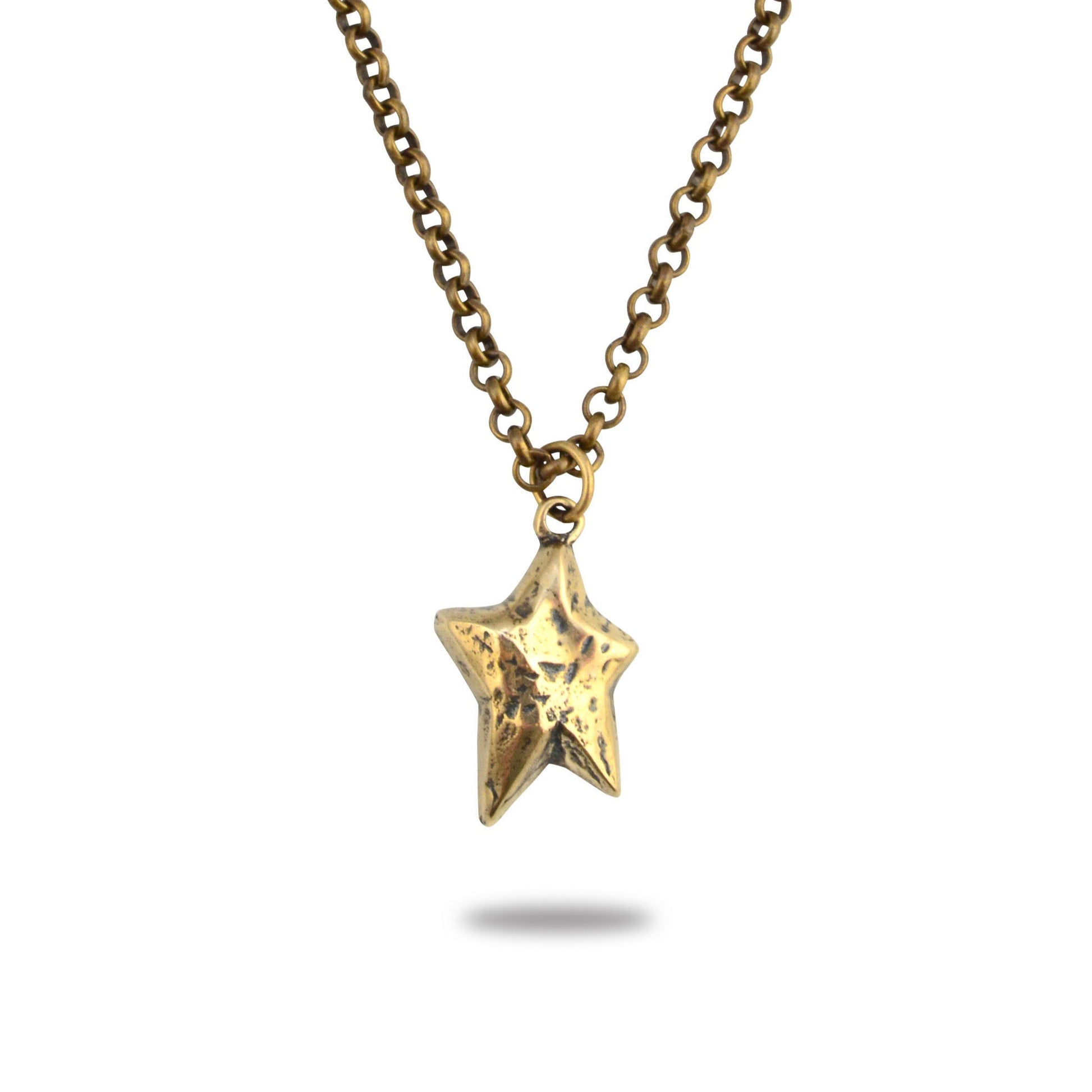 A bronze necklace with a star-shaped pendant, displayed against a white background.