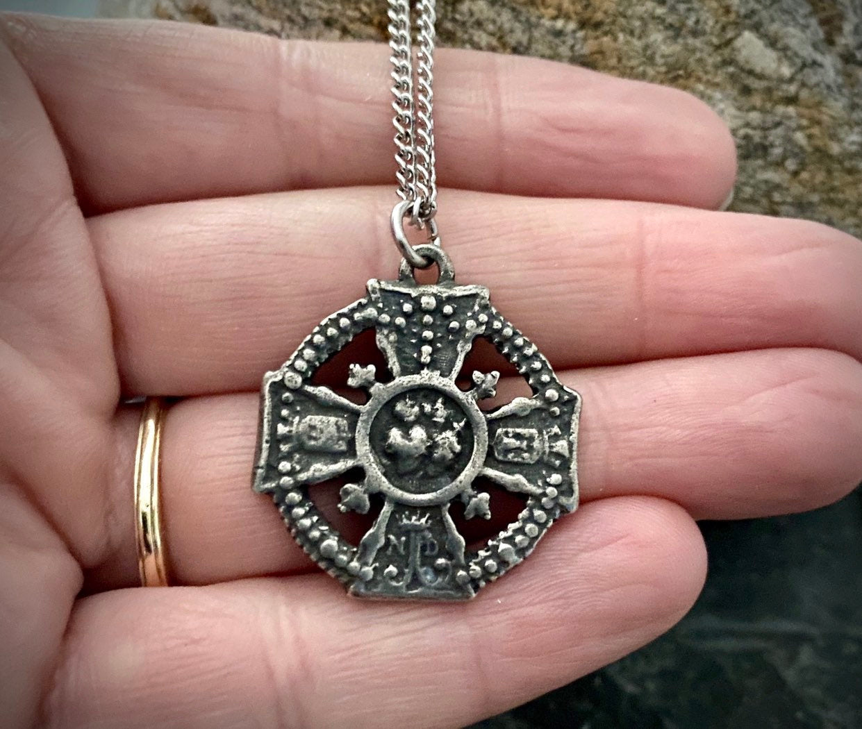 Sacred and Immaculate Hearts in the middle of a cross. The sides of the cross depict "ND" for Notre Dame, 20 or 24 inch chain ST-020